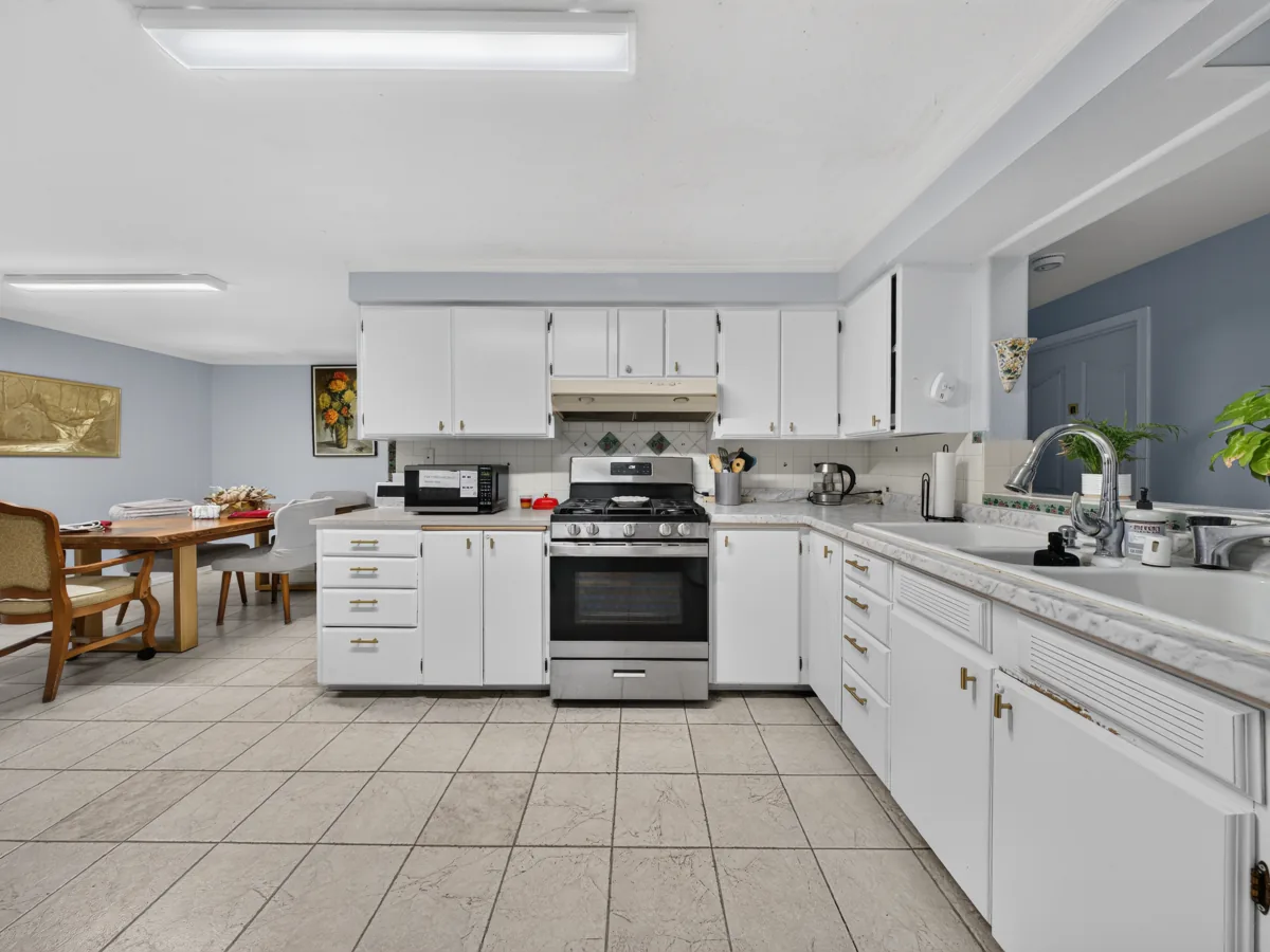 Kitchen and family-style dining table at A Care Of Joy adult family home