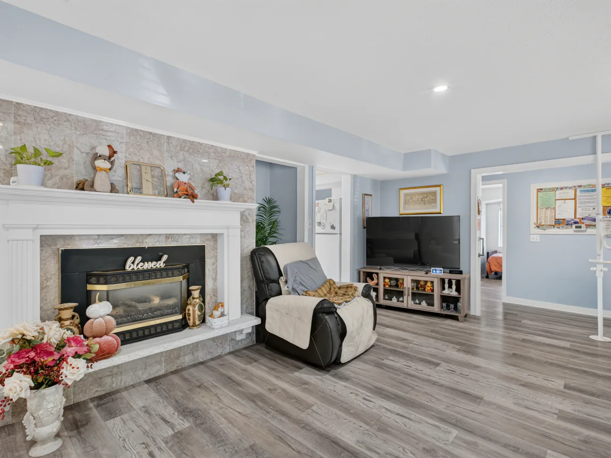 Fireplace lounge used by memory care families at A Care Of Joy
