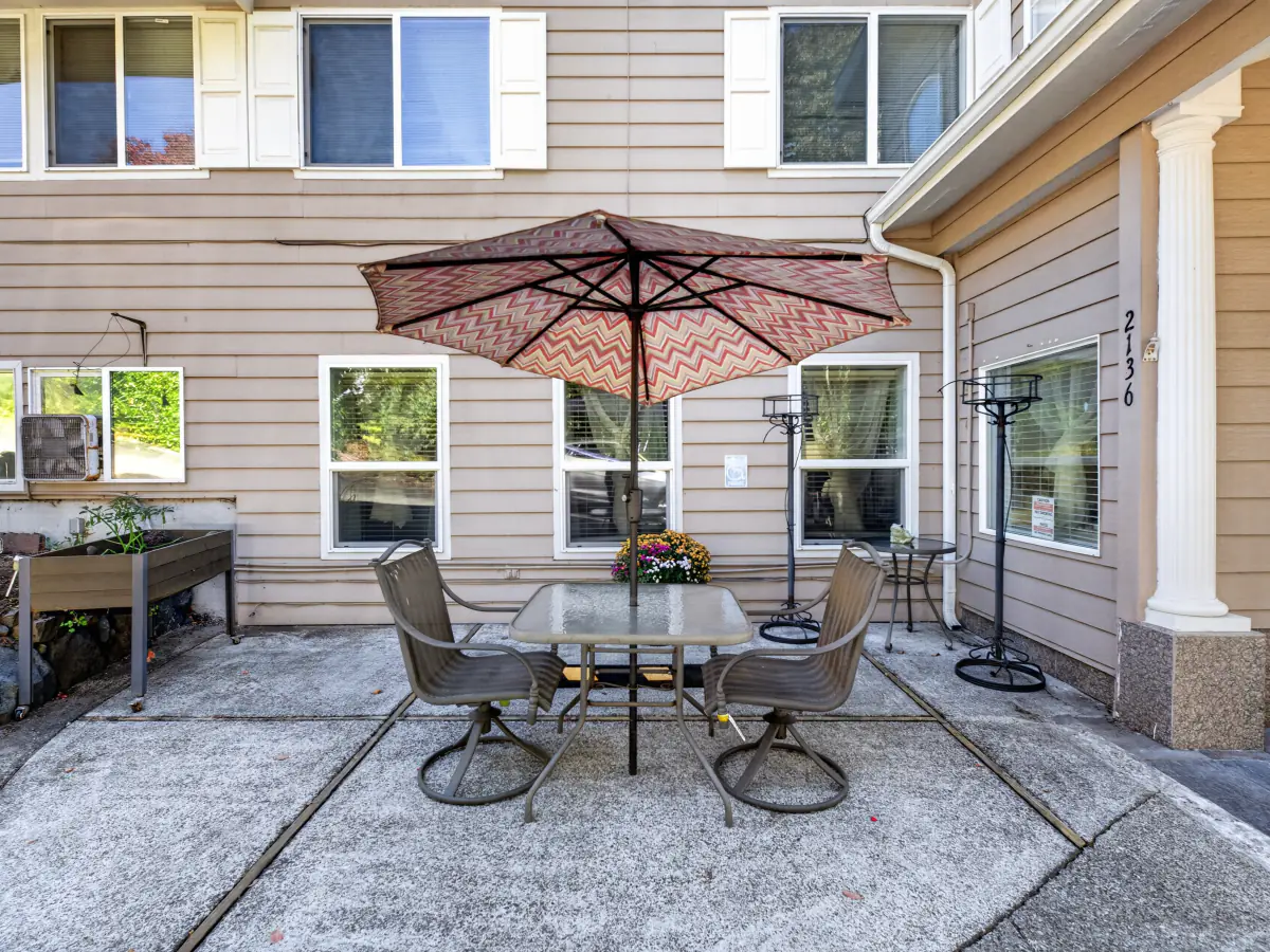 Shaded patio table at A Care Of Joy adult family home, University Place